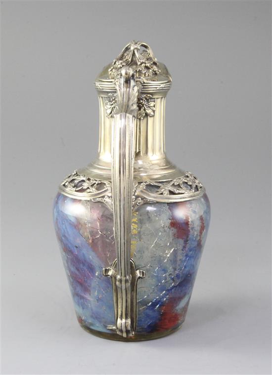 A French 950 standard silver gilt mounted coloured crackle glass claret jug, 22cm.